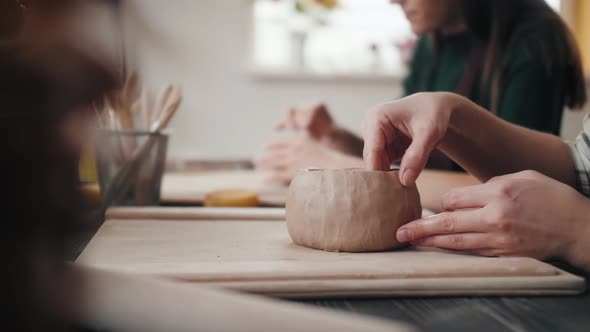 Closeup on Artist Hands Personalizing a Clay Cup Traditional Latin American Dishes Craftsman