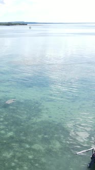 Vertical Video Boats in the Ocean Near the Coast of Zanzibar Tanzania