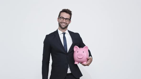 Businessman with Piggy Bank