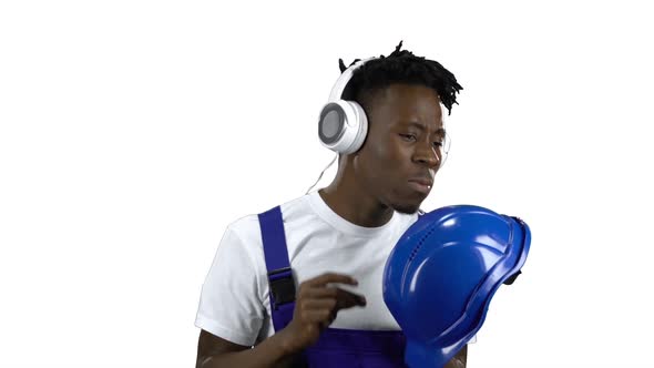 African American Worker Listening To Music on Headphones. Alpha Channel