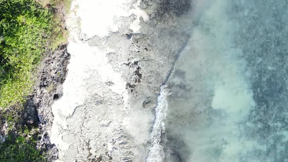 Vertical Video of the Ocean Near the Coast of Zanzibar Tanzania Aerial View