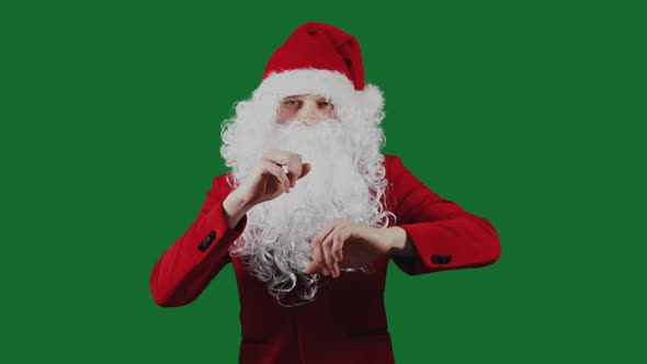 Man Like a Santa Claus Dances on Green Screen Chromakey Background. Christmas and New Year Concept