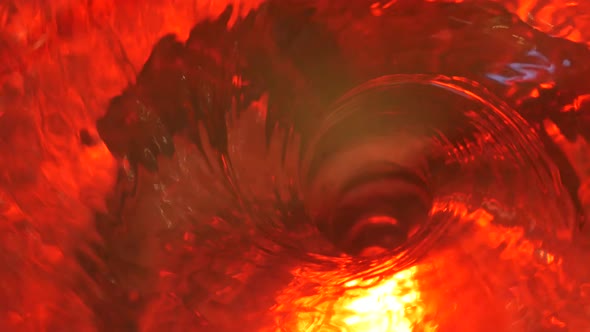 Symbol of Hell, Inferno and Infinity. Red Liquid Hypnotic Aqua Swirl Turning. Meditative Ruby