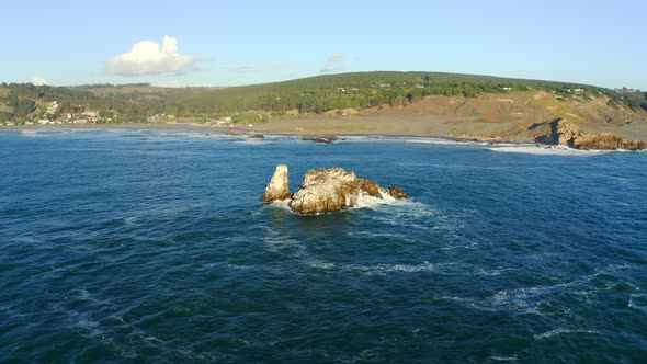 Playa de matanzas surf spot wind surfing and kite surf, drone shot orbital rock, chile puertecillo t