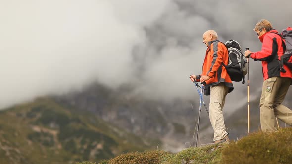 Two Senior Hikers on Hilltop