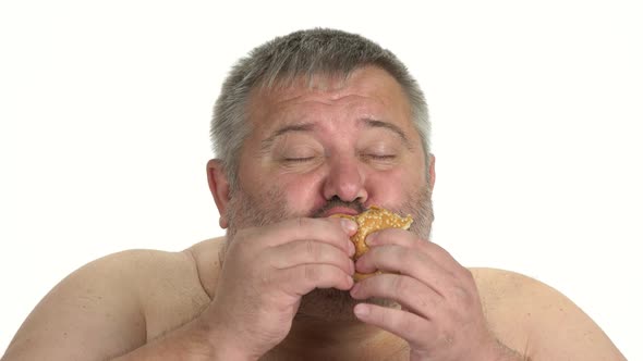 Close Up of Hungry Man Eating Burger on White Background