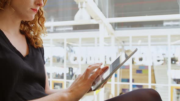 Businesswoman using digital tablet in office 4k