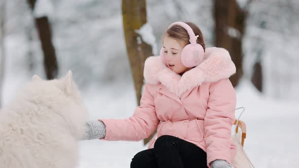 Girl with Dog in Winter