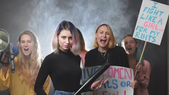 Group of Feminists Girls Standing with Bats, Megaphones and Posters Fighting for Feminism
