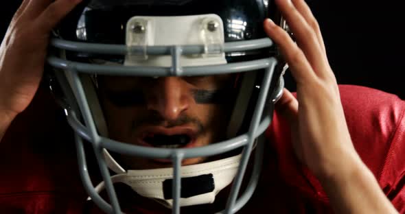 American football player with a head gear