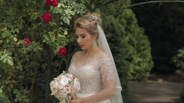 Wedding Bouquet in the Hands of the Bride. Wedding Day. Engagement