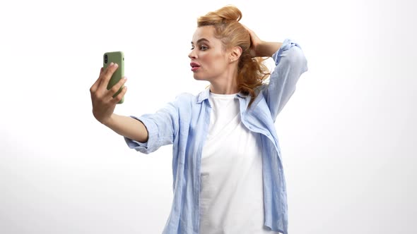 Smiling Woman Touch Her Hair in Front of Mobile Phone Camera Selfie Video