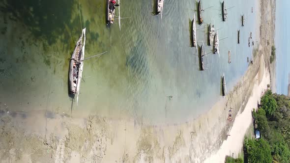 Tanzania Vertical Video  Boat Boats in the Ocean Near the Coast of Zanzibar Aerial View