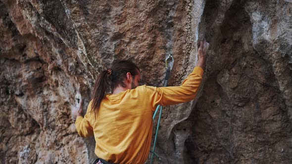 Slow Motion of Strong Man Rock Climber Climbing Overhanging Tough Challenging Route Making Wery Hard