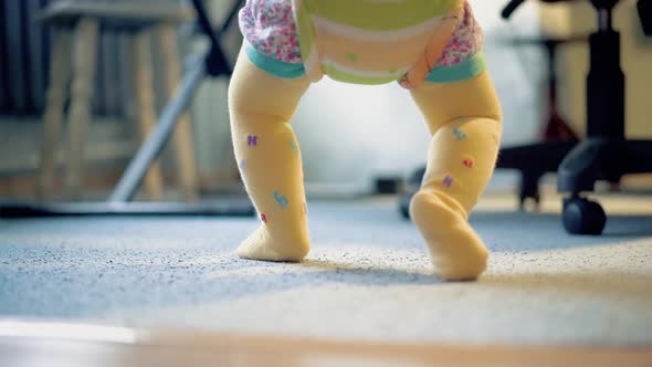 Little Child Jumps with the Help of Special Equipment