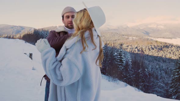 Couple in Winter in the Mountains