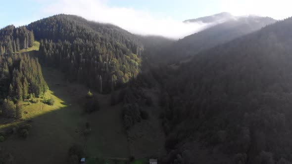 Aerial View of Dawn Over the Mountains. Fog and Clouds Hovered Mountain Tops