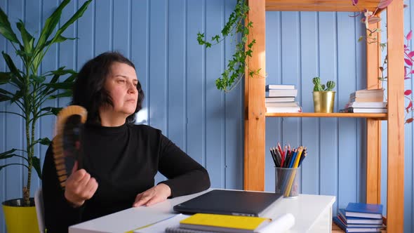 Overheated Woman Feeling Hot Waving Fan Annoyed with High Temperature