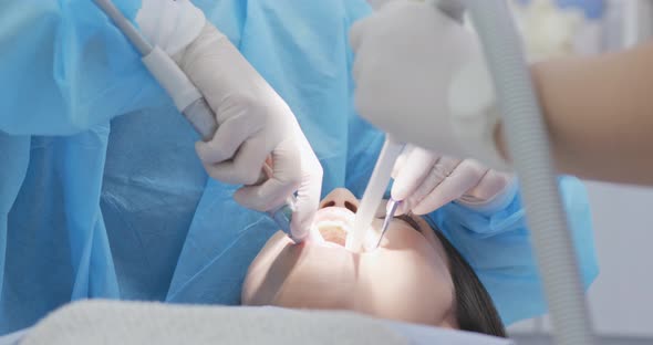 Woman checking on her teeth at dental clinic