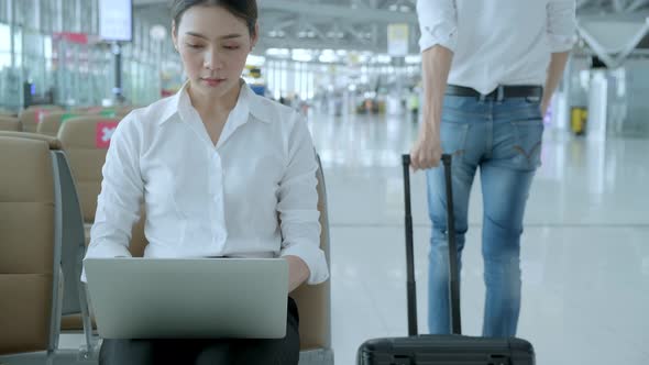 Social distancing, businesswoman sit working with laptop keeping distance