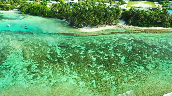 Aerial drone view panorama of tropical island beach break by aqua blue ocean and white sand backgrou