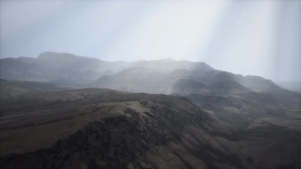 Sun Rays Against the Backdrop of the Mountains