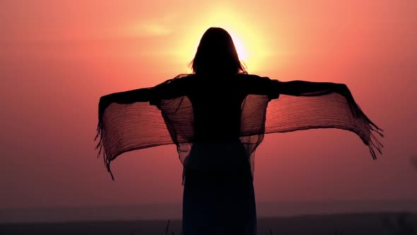 Back View Woman with Long Hair Posing Outdoors at Sunrise