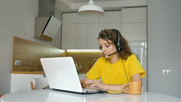 Young Woman is Having Online Meeting Using Her Laptop Businesswoman with Digital Tablet Sitting on