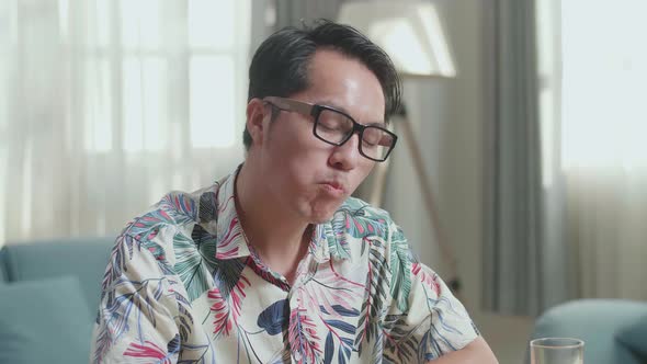 Close Up Of Smiling Asian Man Enjoys Eating Healthy Food At Home