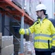 Follow footage of employees male warehouse worker engineer in hard hat working - VideoHive Item for Sale