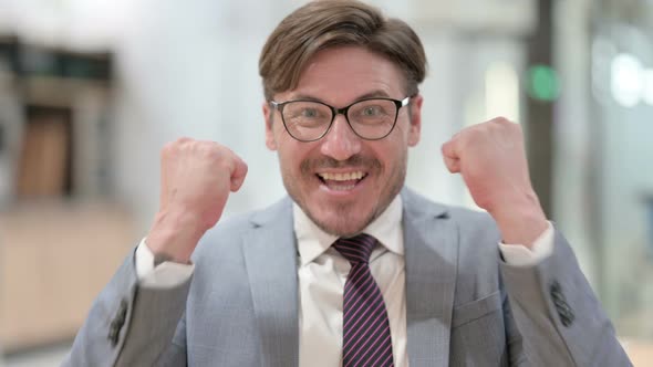 Portrait of Excited Businessman Celebrating Success