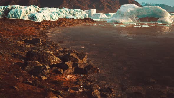 Antarctic Icebergs Near Rocky Beach