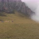 Aerial Shot of a Camp of Climbers in the Mountains Among the Clouds. - VideoHive Item for Sale