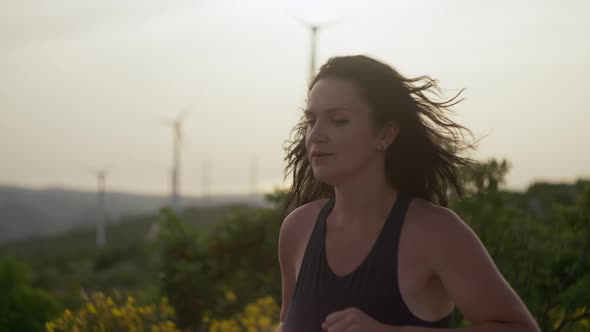 Slow Motion Closeup Video of a Girl Running in a Mountain Landscape