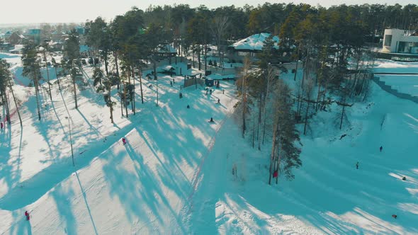 Mountain Slope with Ski Track at Modern Winter Resort Aerial