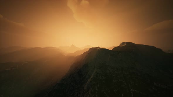 High Mountain Peaks Covered with Dramatic Heavy Fog