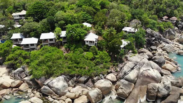 Small Houses on Tropical Island. Tiny Cozy Bungalows Located on Shore of Koh Samui Island Near Calm