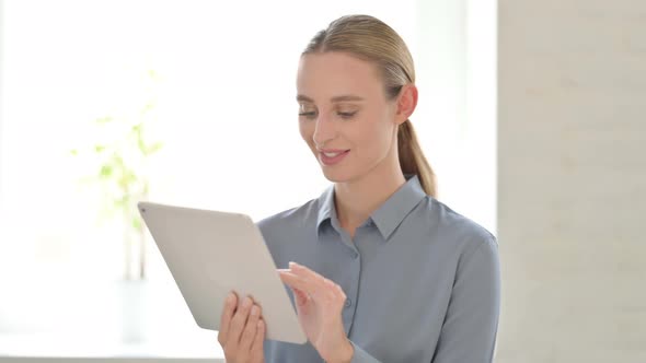 Portrait of Woman Using Digital Tablet