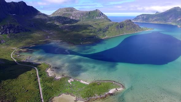 Aerial shot of scenic route around fjord on Lofoten islands in Norway