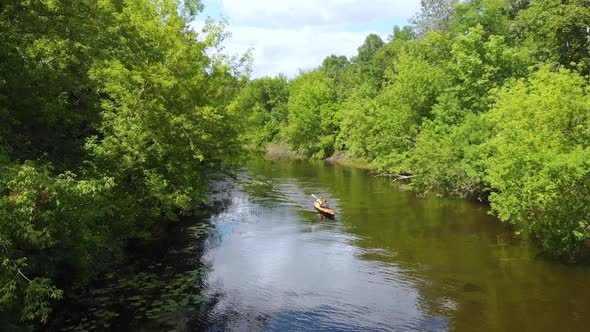 Aerial Drone View of Sport Canoe on Summer Calm Forest River
