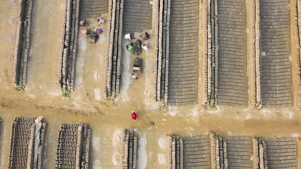 Aerial view of people working in a brick factory, Dhaka, Bangladesh.