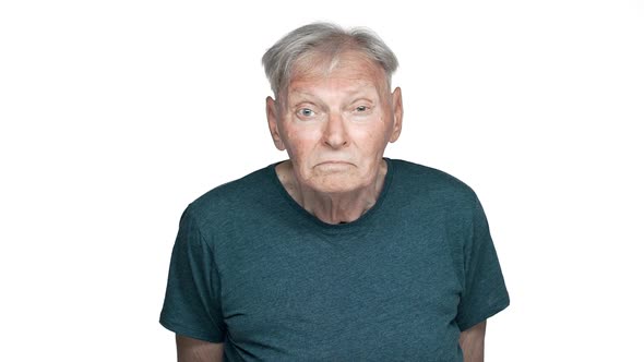 Portrait of Displeased Old Aged Man 80s Having Gray Hair in Basic Tshirt Staring at you with