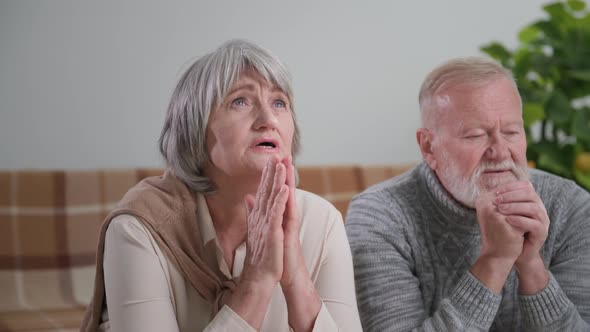 Prayer an Elderly Wife with Her Old Husband Pray with Closed Eyes and Folded Hands Standing on the alt