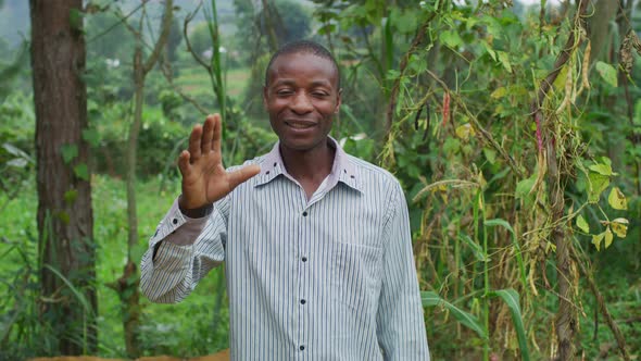 African man waving hand