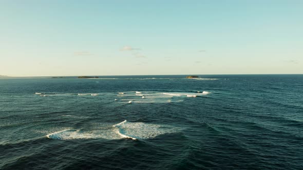 Ocean with Waves and Rocky Islands. Siargao Philippines