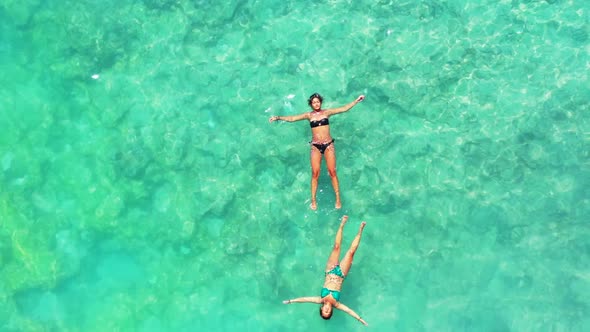 Beautiful women relaxing on paradise coastline beach trip by transparent water with white sandy back