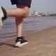 Muscular Young Man Running on the Beach in the City on a Sunny Day - VideoHive Item for Sale