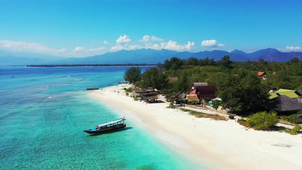 Tropical drone copy space shot of a sunshine white sandy paradise beach and aqua blue ocean backgrou