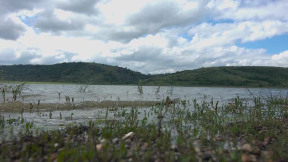 Timelapse lake and clouds.