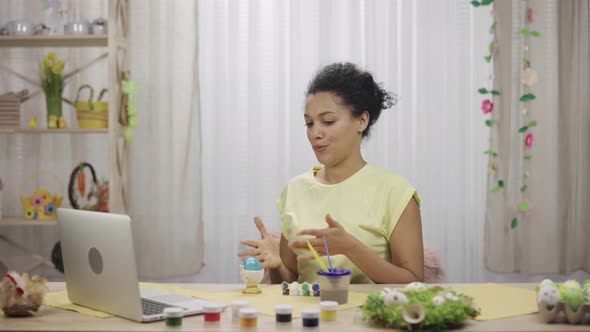 Cute African American Woman Talking By Video Call on Laptop